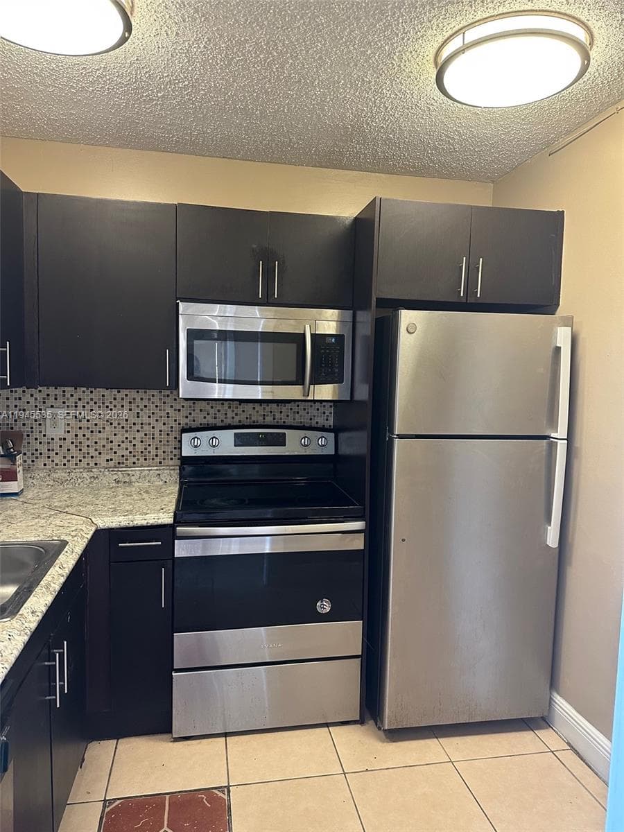 Condominium at 488 NW 165th St Rd # 115, Miami FL 33169
