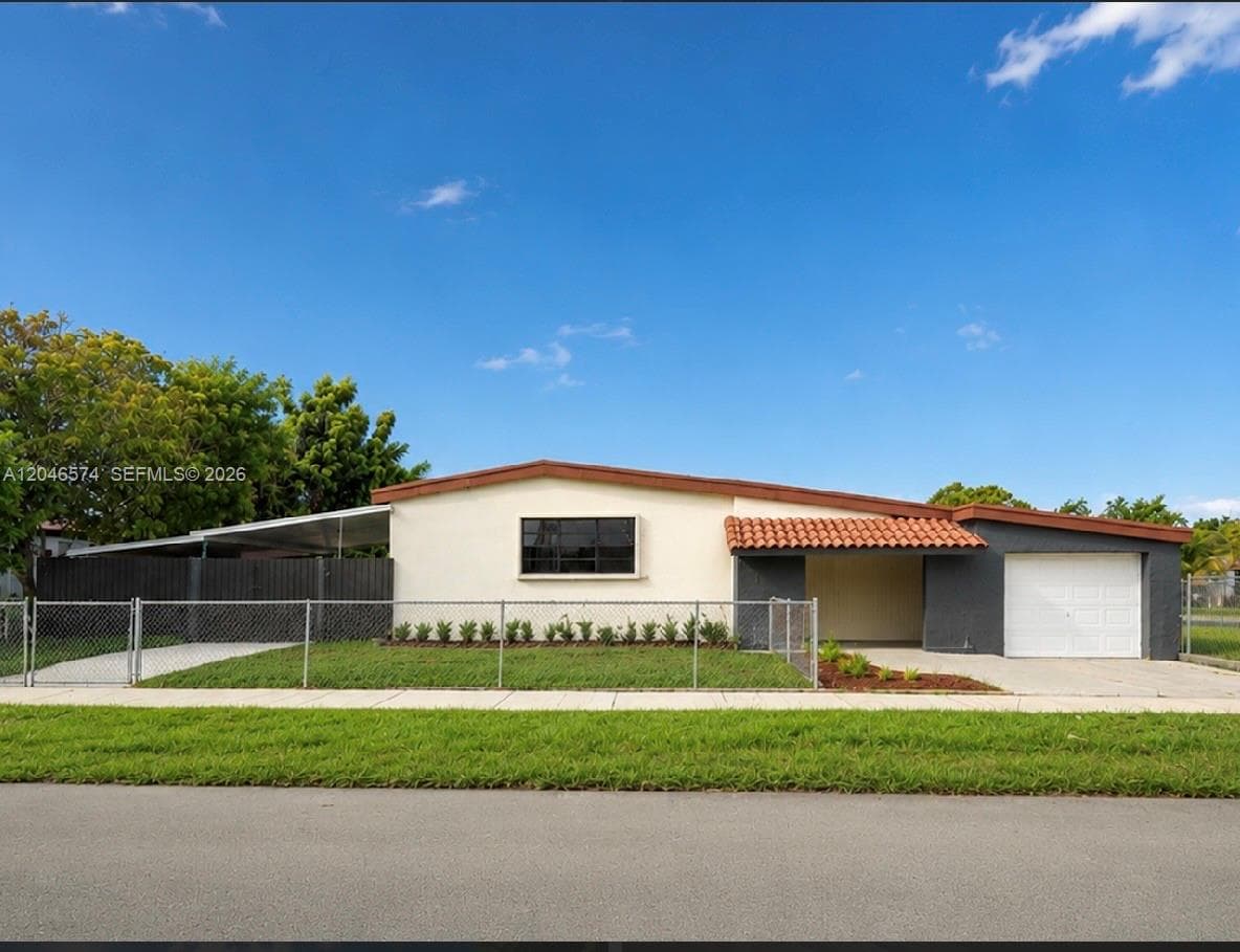 Single Family Residence at 620 NW 182nd Ter, Miami Gardens FL 33169