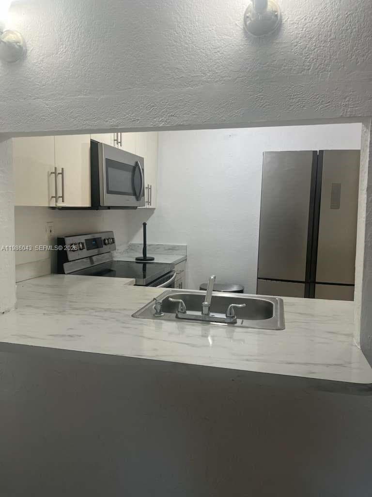 Condominium at 4550 NW 9th St # 114E, Miami FL 33126